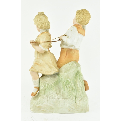 227 - Gebruder Heubach, Germany - A continental bisque ceramic figure groups of children playing. The figu... 