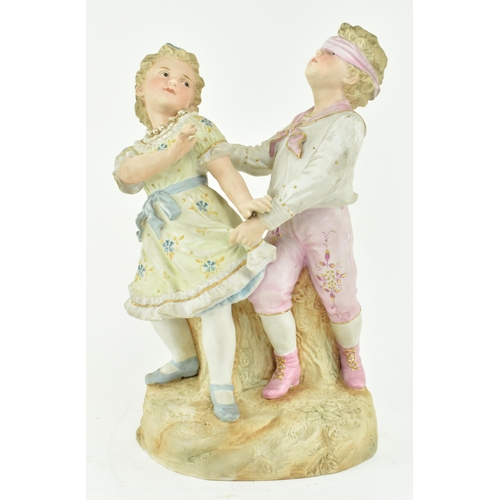 228 - Gebruder Heubach, Germany - A continental bisque ceramic figure group of children playing. The figur... 