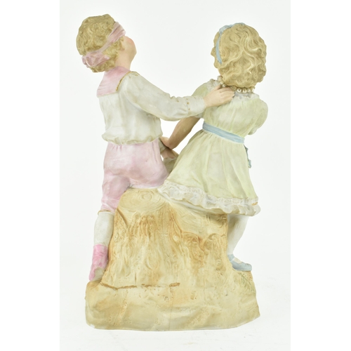 228 - Gebruder Heubach, Germany - A continental bisque ceramic figure group of children playing. The figur... 