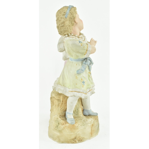 228 - Gebruder Heubach, Germany - A continental bisque ceramic figure group of children playing. The figur... 