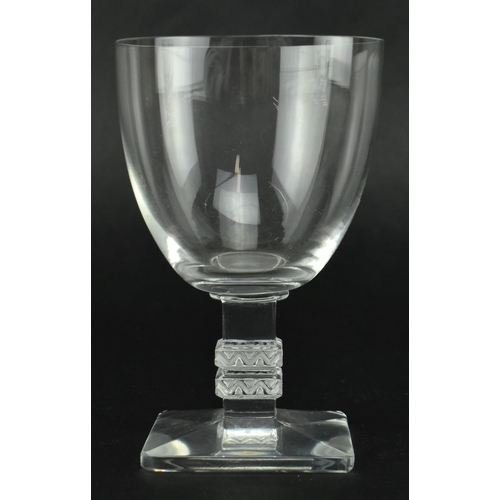 23 - A set of five Lalique Argos clear glass table glasses. Each with a stepped square column with moulde... 