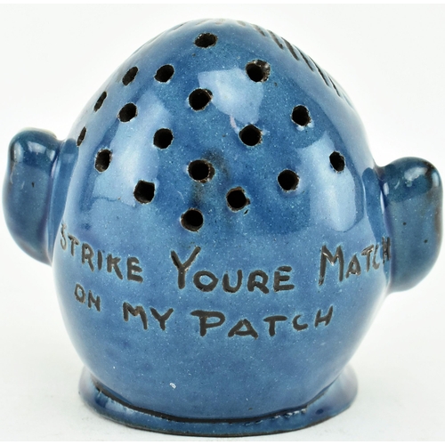 231 - A Grotesque Dartmouth Pottery inspired ceramic match striker / ashtray. The match striker in the sha... 