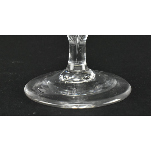 25 - A circa 1740 Jacobite engraved wineglass. The glass with ogee bowl featuring engraved rose design, o... 