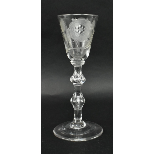 25 - A circa 1740 Jacobite engraved wineglass. The glass with ogee bowl featuring engraved rose design, o... 