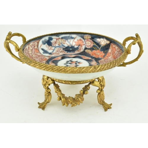 26 - A Japanese 19th century gilt ormolu mounted & ceramic hand painted Imari bowl. The bowl hand painted... 