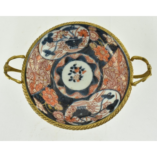 26 - A Japanese 19th century gilt ormolu mounted & ceramic hand painted Imari bowl. The bowl hand painted... 