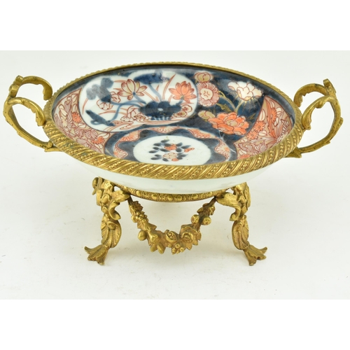 26 - A Japanese 19th century gilt ormolu mounted & ceramic hand painted Imari bowl. The bowl hand painted... 