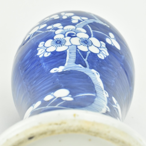 3 - A Chinese Oriental 19th century hand painted ceramic Prunus pattern baluster lidded vase. The vase h... 