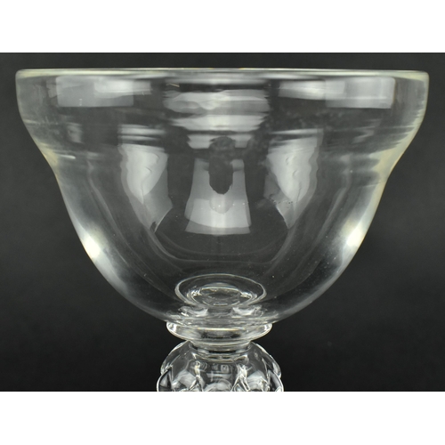 43 - A George III early 19th century hand blown sweetmeat glass. The sweetmeat having an ogee bowl over a... 