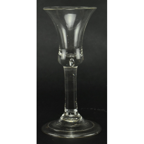 56 - A late George II 18th century circa 1760 hand blown wine drinking glass. The glass having a bell sha... 