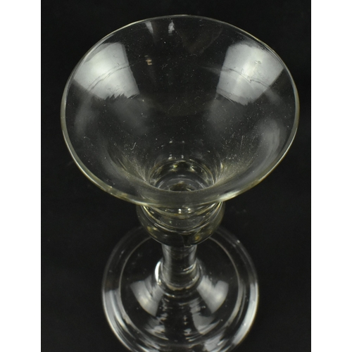 56 - A late George II 18th century circa 1760 hand blown wine drinking glass. The glass having a bell sha... 