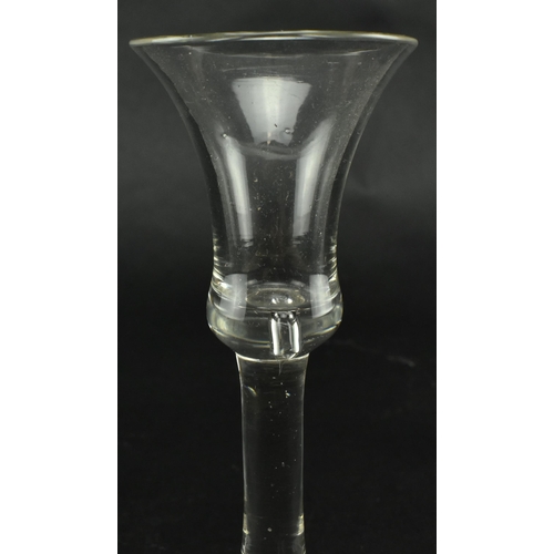 56 - A late George II 18th century circa 1760 hand blown wine drinking glass. The glass having a bell sha... 