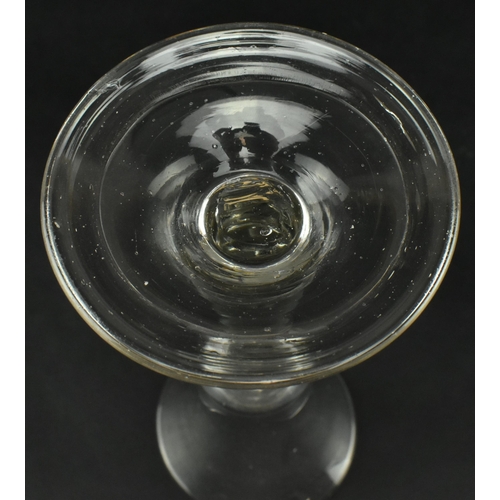 56 - A late George II 18th century circa 1760 hand blown wine drinking glass. The glass having a bell sha... 