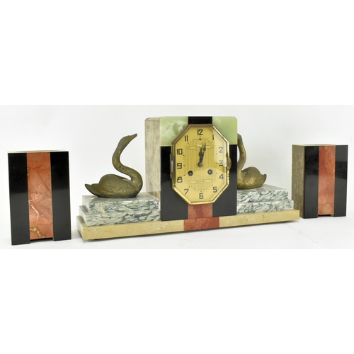 59 - Pierre Megnin Seloncourt - A French Art Deco early 20th century 1930s marble & onyx mantle clock. Th... 