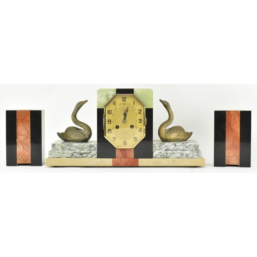 59 - Pierre Megnin Seloncourt - A French Art Deco early 20th century 1930s marble & onyx mantle clock. Th... 