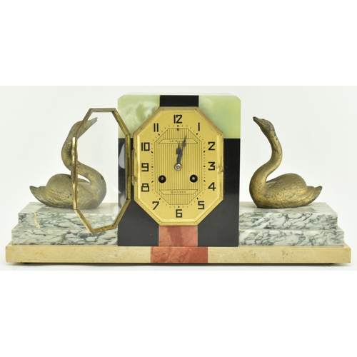 59 - Pierre Megnin Seloncourt - A French Art Deco early 20th century 1930s marble & onyx mantle clock. Th... 