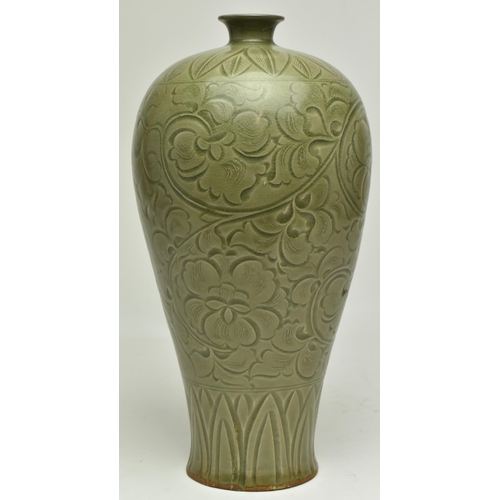 60 - A Chinese early Ming Dynasty Yaozhou stoneware glazed meiping baluster celadon vase. The vase decora... 