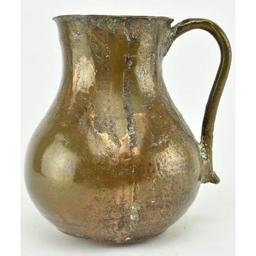 61 - A circa 15th century seamed bronze vessel / jug. The vessel with rounded base, bulbous body & flared... 