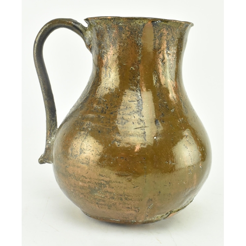 61 - A circa 15th century seamed bronze vessel / jug. The vessel with rounded base, bulbous body & flared... 