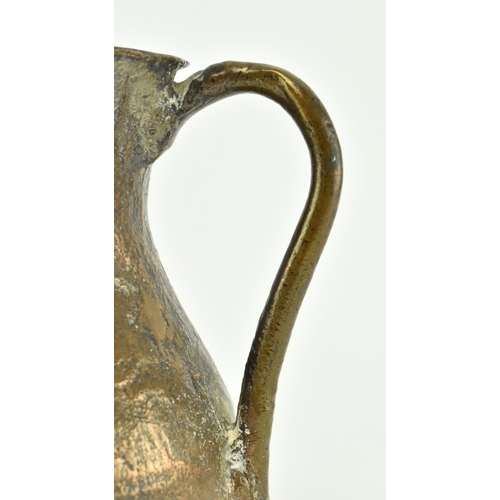 61 - A circa 15th century seamed bronze vessel / jug. The vessel with rounded base, bulbous body & flared... 