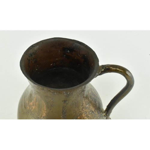 61 - A circa 15th century seamed bronze vessel / jug. The vessel with rounded base, bulbous body & flared... 