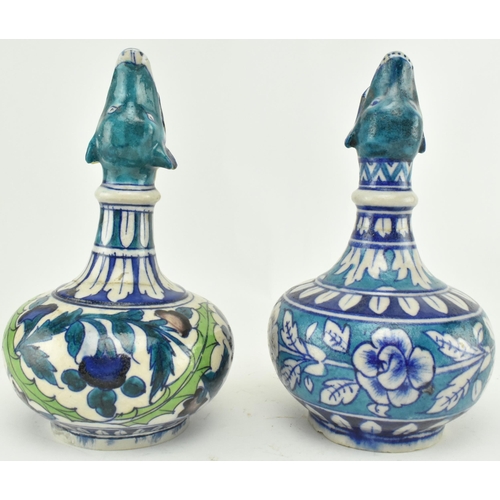 66 - A matched pair of believed 19th century Turkish Iznik pottery hand painted ceramic wine / water jugs... 