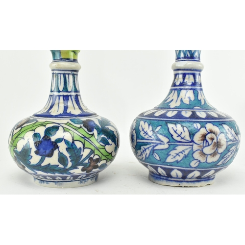 66 - A matched pair of believed 19th century Turkish Iznik pottery hand painted ceramic wine / water jugs... 