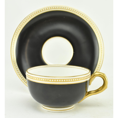 67 - A Royal Worcester for Waring & Gillow London fine bone china cup and saucer. The cup in black with g... 