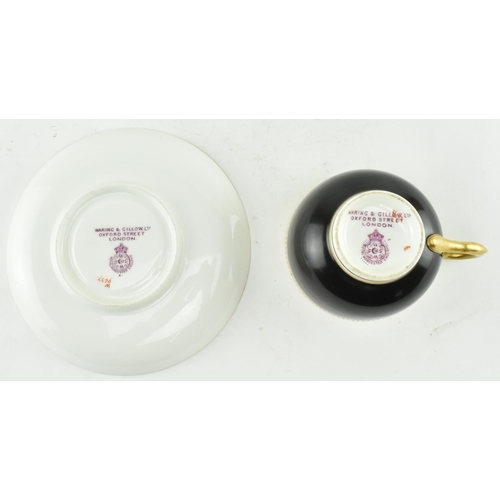 67 - A Royal Worcester for Waring & Gillow London fine bone china cup and saucer. The cup in black with g... 