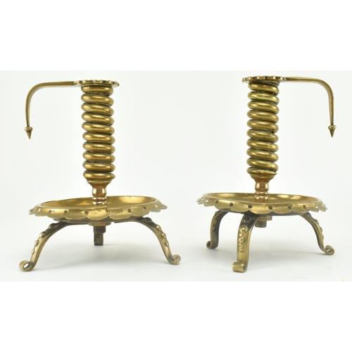 77 - A pair of German continental 19th century brass spiral chamber candle holders. Each candle holder ha... 