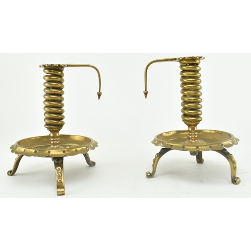 77 - A pair of German continental 19th century brass spiral chamber candle holders. Each candle holder ha... 