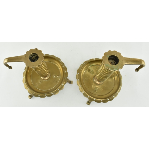 77 - A pair of German continental 19th century brass spiral chamber candle holders. Each candle holder ha... 