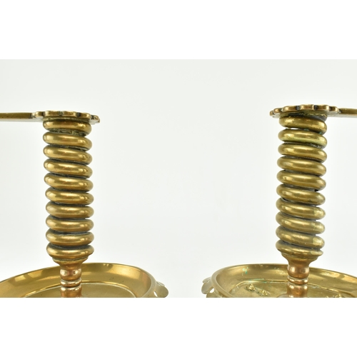 77 - A pair of German continental 19th century brass spiral chamber candle holders. Each candle holder ha... 