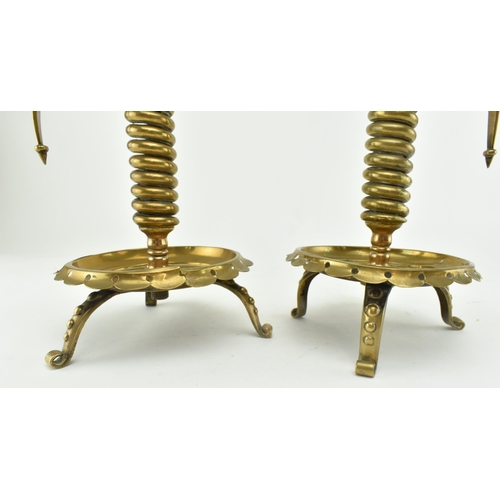 77 - A pair of German continental 19th century brass spiral chamber candle holders. Each candle holder ha... 