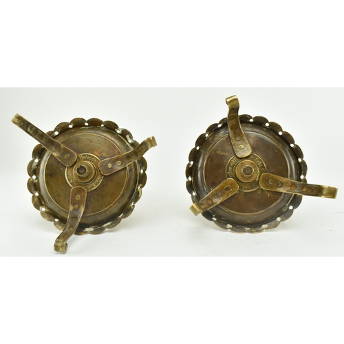 77 - A pair of German continental 19th century brass spiral chamber candle holders. Each candle holder ha... 