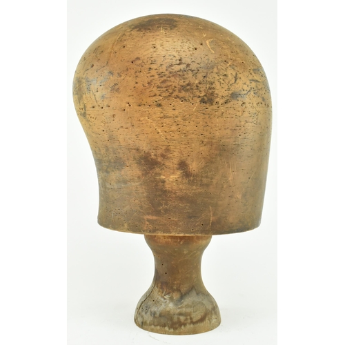 81 - A 19th century beech hat block on stand used in millinery. The hat block inscribed 66063/4 to front ... 