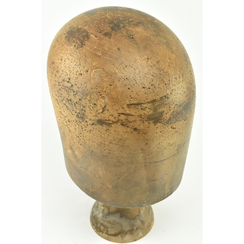 81 - A 19th century beech hat block on stand used in millinery. The hat block inscribed 66063/4 to front ... 