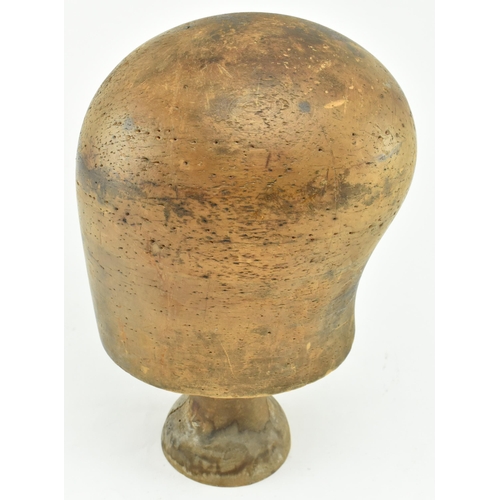 81 - A 19th century beech hat block on stand used in millinery. The hat block inscribed 66063/4 to front ... 