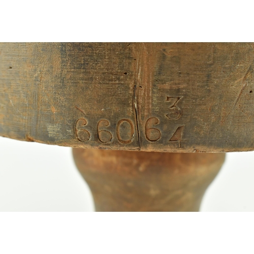 81 - A 19th century beech hat block on stand used in millinery. The hat block inscribed 66063/4 to front ... 