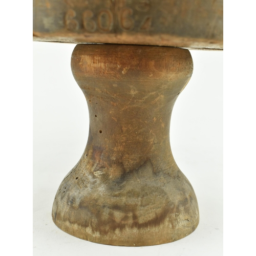 81 - A 19th century beech hat block on stand used in millinery. The hat block inscribed 66063/4 to front ... 