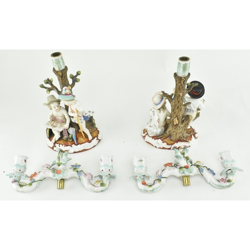 88 - A pair of German late 19th century Sitzendorf porcelain twin armed candelabra candlesticks. Each can... 