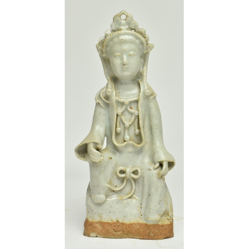 98 - A Chinese Ming dynasty Longquan celadon figure of Guanyin. Depicting Guanyin adorned in an elaborate... 