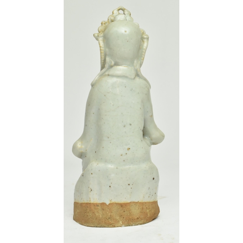 98 - A Chinese Ming dynasty Longquan celadon figure of Guanyin. Depicting Guanyin adorned in an elaborate... 