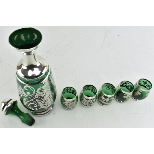 99 - A set of Venetian emerald glass decanter and glasses with silver overlay. Comprises a decanter with ... 