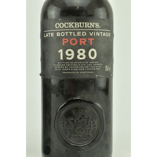 242 - Two vintage Portuguese Cockburn's Port / Porto bottles. The lot to include a circa 1970s/80s Cockbur... 