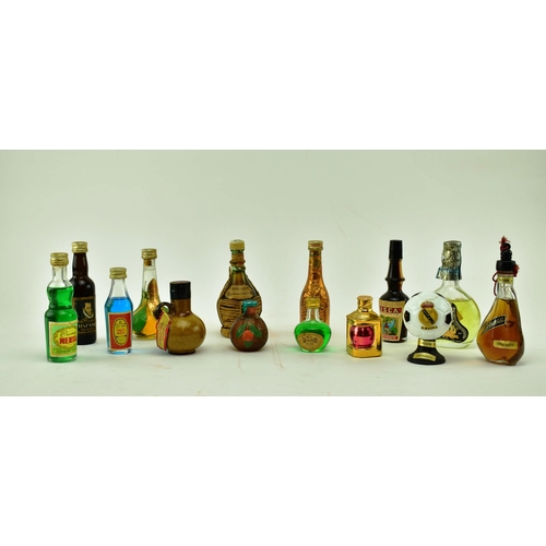 241 - A large collection of miniature bottles of brandy, cognac, whisky, gin, rum and other spirits and li... 