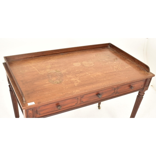 251 - Gillows of Lancaster - A Regency early 19th century mahogany three drawer writing table. The desk ha... 