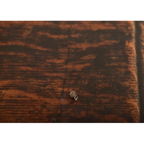 252 - A 17th century Queen Anne oak and walnut chest of drawers. The chest having a bank of four short and... 