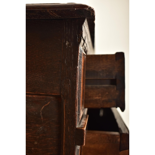 252 - A 17th century Queen Anne oak and walnut chest of drawers. The chest having a bank of four short and... 