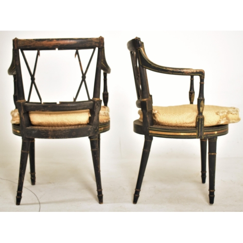 255 - A pair of Regency early 19th century ebonised & gilt parcel armchairs. Each chair having a lattice w... 